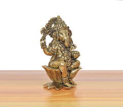 Bronze Ganapati Bappa statue, three-quarter view with long arm and lotus base