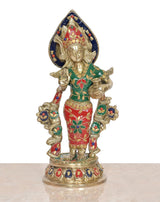 Radha brass idol, front view, dark blue halo headdress, red skirt, green accents