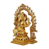 Brass Ganesha statue in ornate arched frame, seated with one hand raised
