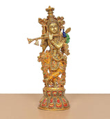 Handcrafted brass Krishna idol with flute, peacock feather, and detailed Meenakari