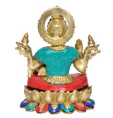 Lakshmi idol back view, gold halo and teal/red tiled dress, seated on lotus base