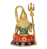 Brass Shiva sculpture, rear/side view, gold halo and trident, green blouse and red base
