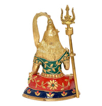 Brass Shiva sculpture, rear/side view, gold halo and trident, green blouse and red base
