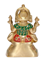 Brass Ganesh statue from behind, decorative crown and green-red skirt details