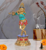 Brass Krishna playing flute idol, turquoise tunic and red jewel base