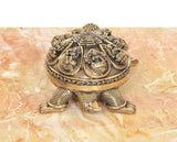 Bronze tortoise figurine top closeup with detailed engraved yantra pattern