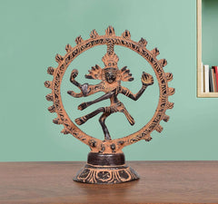 Brass Natraj Lord Shiva dancing sculpture with circular halo base, ornate detailing