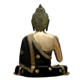 Brass Medicine Buddha statue back view, black robe with gold decorative trim