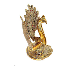 Gold-toned metal peacock lover showpiece, side view, one peacock figure on round base