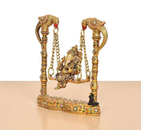 Ganesha swing statue on patterned base with hanging chain links, multicolor