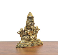 Tirupati Bala Ji brass face showpiece, angled view with temple-like crown and arms
