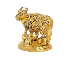 Golden brass cow with calf figurine, front three-quarter view on round base