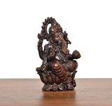Lord Ganesha brass idol rear view, seated with sculpted ornaments and fan-like crown
