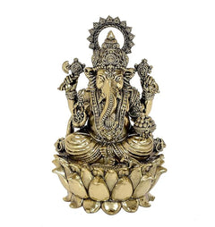 Brass Ganesh idol seated on a lotus base with ornate crown and jewelry