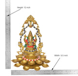 Brass Ganesh diya showpiece with 21 lamps; height 12 inch shown with measuring ruler