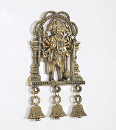 Bronze Panchmukhi Hanuman idol with ornate arch and three hanging bells, angled view.