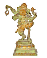 Brass dancing Ganesha idol statue, rear/side view, decorative halo and trunk ornaments