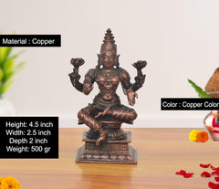Copper Lakshmi idol, 4.5 inches tall; seated figure with four arms and crown.