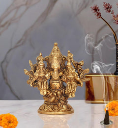 Brass Ganesha idol with Riddhi and Siddhi, ornate multi-figure base
