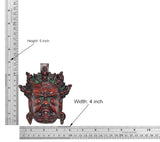Brass Mahakala wall hanging mask, multicolored; height 5 inch and width 4 inch shown