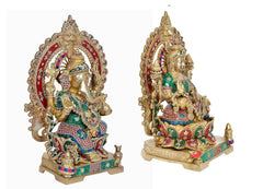 Brass Lakshmi and Ganesh idols from side angles, ornate arch frames and painted garments