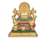 Brass Ganesha idol from back, decorative halo and jeweled belt, colorful base edge