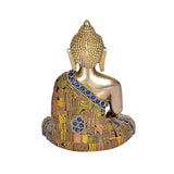 Brass Buddha statue, back/side view with patterned multicolor robe and blue gems