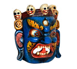 Mahakala wooden wall mask: close-up, blue face with golden droplet and open grin