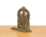 Brass Ram Darbar statue viewed from side, arched carved frame with three figures