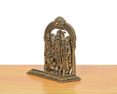 Brass Ram Darbar statue viewed from side, arched carved frame with three figures