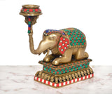 Brass elephant candle stand lamp with curved trunk holder and multicolor patterned body