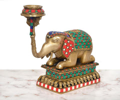 Brass elephant candle stand lamp with curved trunk holder and multicolor patterned body