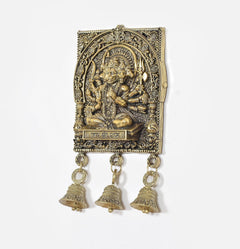 Bronze Hanuman idol wall panel with three bell charms hanging from metal loops