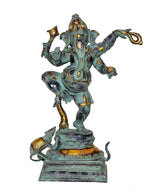 Dancing Ganesha murti with turquoise patina, gold details, standing on base