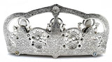 Silver metal sculpture side view with three deities and detailed floral relief canopy