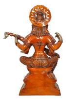 Back view brass Saraswati figurine with arched halo, carved draped torso