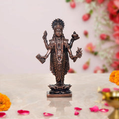 3-inch copper Dhanvantari statue, four arms, ornate robe on lotus pedestal