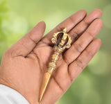 Brass furba phurpa with dorje vajra top and pointed tip, ornate crown detail