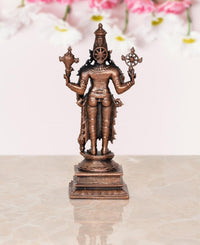 Copper Vishnu statue rear view, central crown and flanking wheel weapons on base