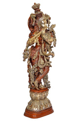 Back view Krishna brass statue with red garments and gold details, ornate crown