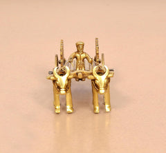 Brass bullock cart showpiece with two bulls and seated driver, close front detail
