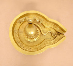 Brass Shiva Ling murti tray detail with engraved leaf pattern and central ling