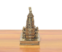 Brass ram mandir model front view with tall central tower and engraved base, 4 in