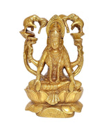 Brass Lakshmi idol seated on lotus, detailed crown and jewelry, elephant trunk arms