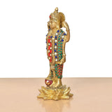 Side view of standing Vishnu idol, gold tone with multicolor jewel-patterned robe