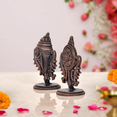 Copper Sanghu and Chakram deity figurines, three-quarter angle showing ridged torso and crown