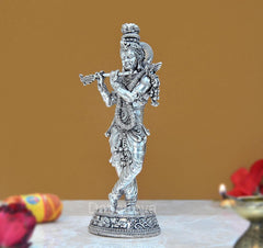 Lord Krishna brass idol playing flute, side view with ornate crown