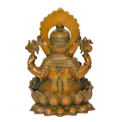 Brass Ganesha idol from behind, rounded halo and engraved back detailing