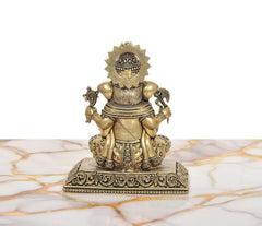 Back view of Lord Ganesha idol with symmetrical ornaments, four arms, and decorative base.