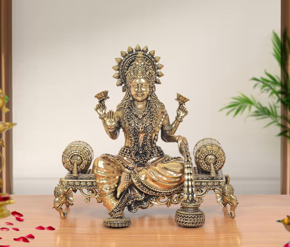 Lakshmi Maa brass idol on singhasan with decorative side elements, front view